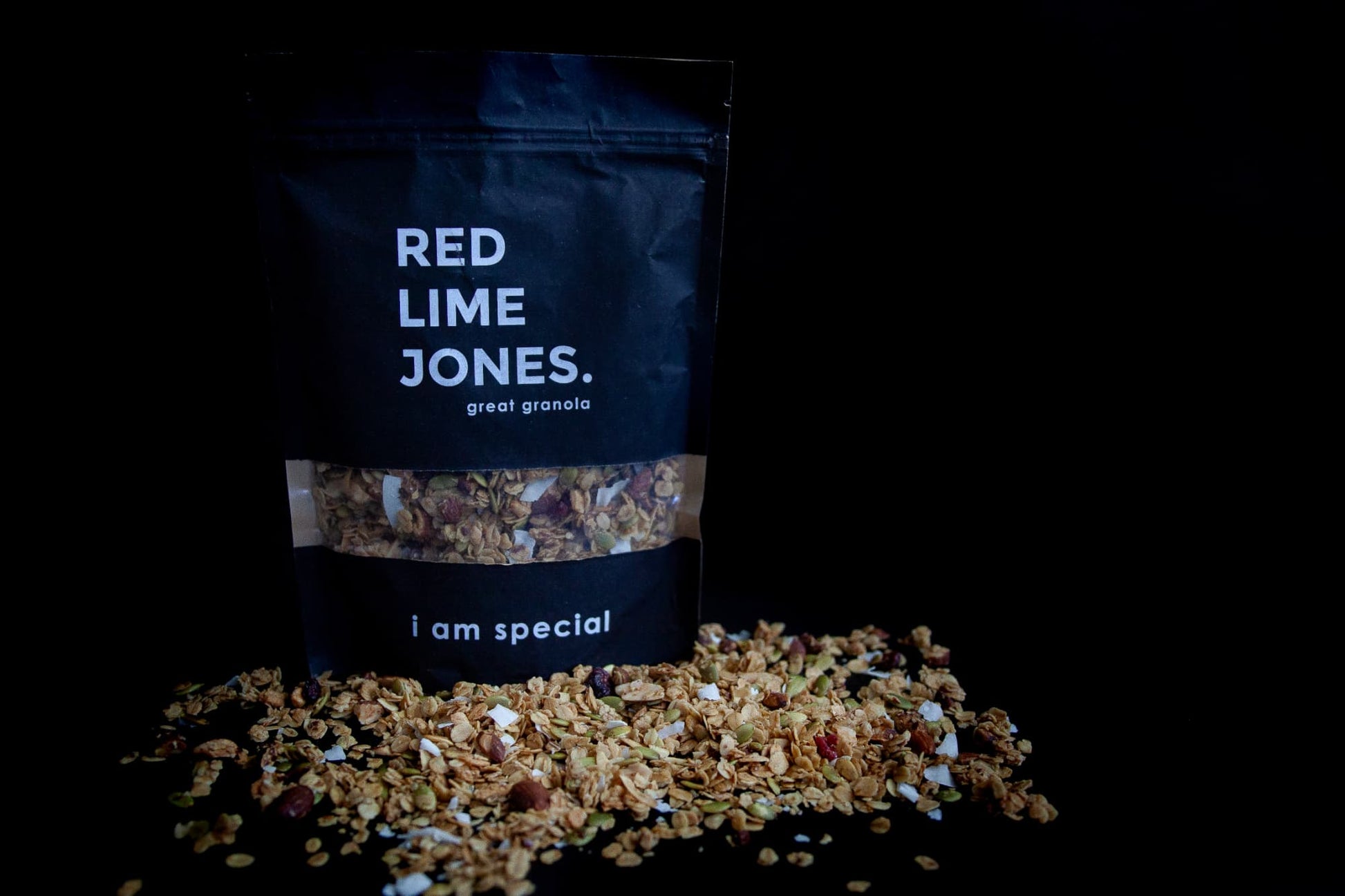 A packet of I am Special Granola with Granola tipped around it