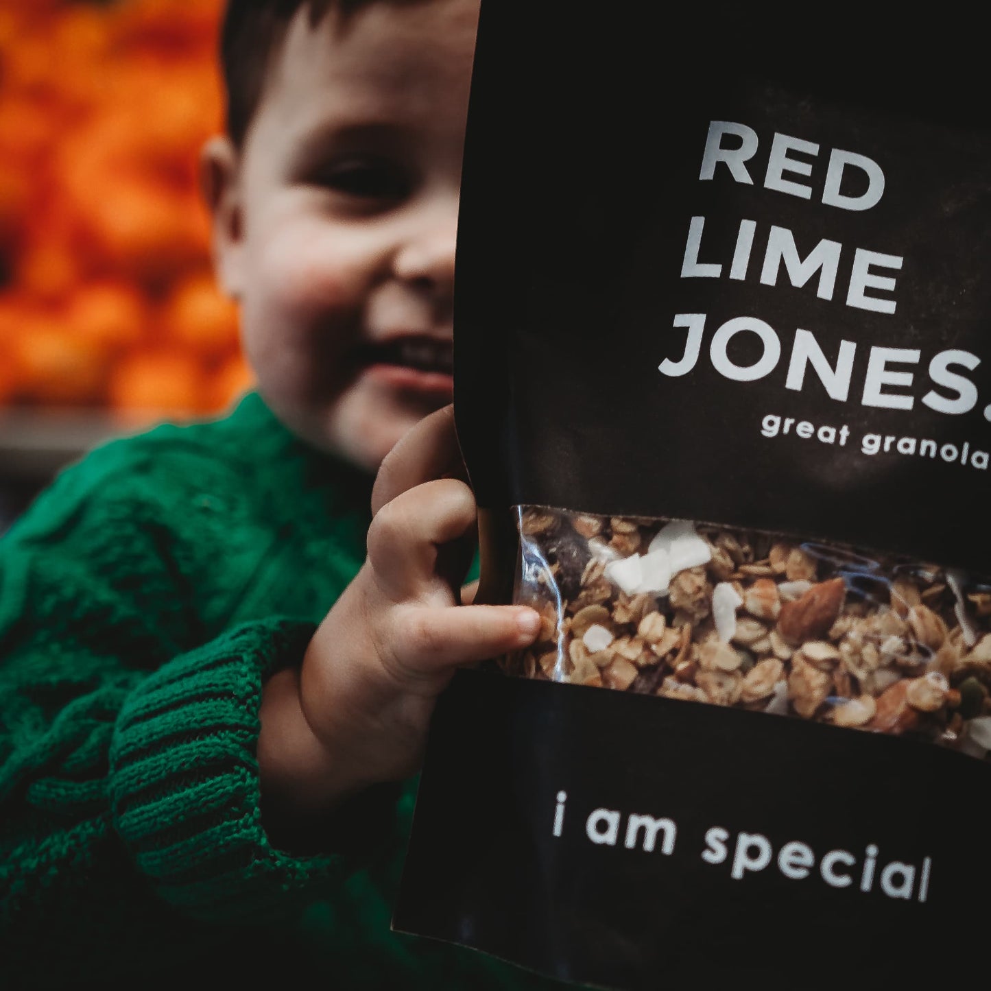 Boy holding packet of I am sassy granola